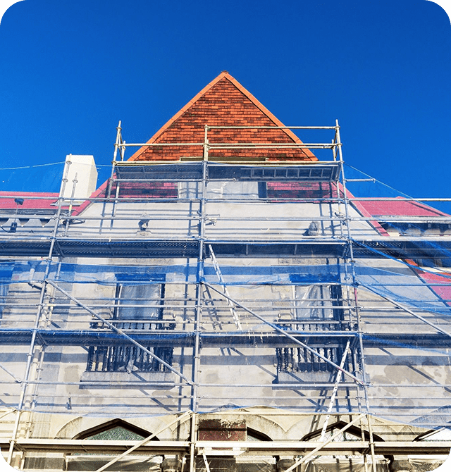 A building with scaffolding on the side of it.