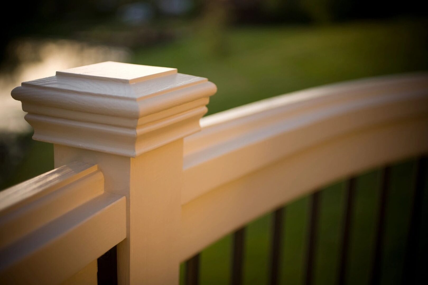 A close up of the top rail on a fence.