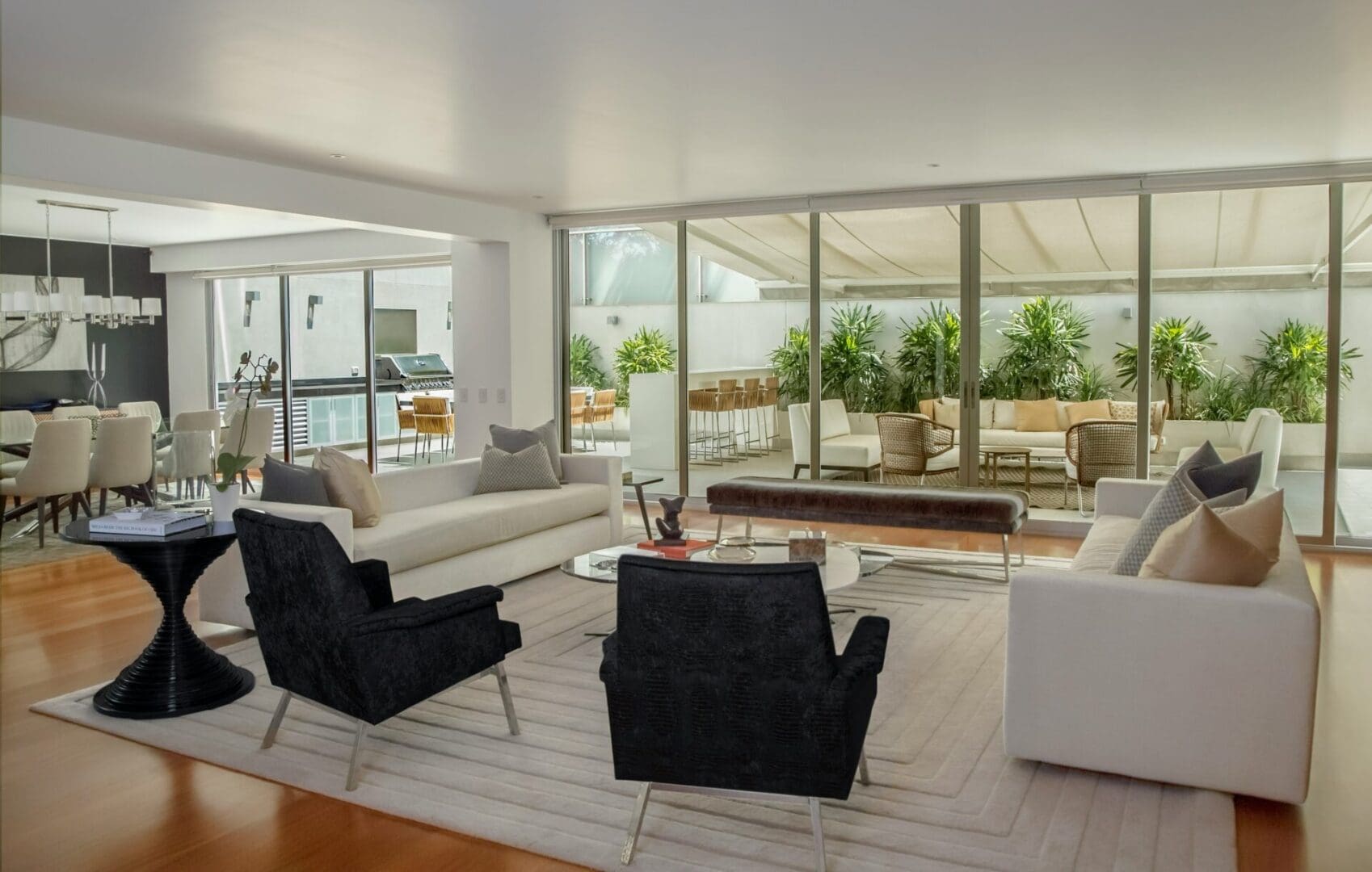 A living room with couches and chairs in it